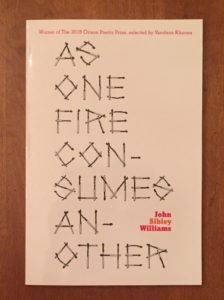 a copy of As One Fire Consumes Another: Poems by John Sibley Williams