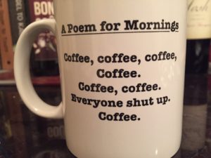 Coffee mug bearing text that reads, "A Poem for Morning": "Coffee, coffee, coffee,/Coffee./Coffee,coffee./Everyone shut up./Coffee.