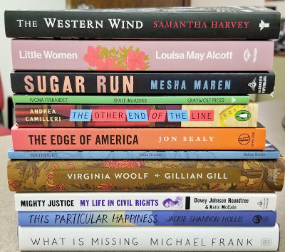 stack of books offered in the giveaway that's linked within the post