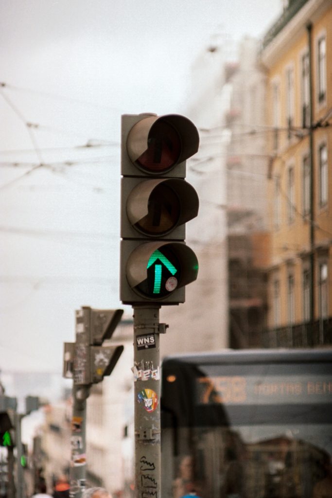 Image of a green traffic light. Photo by Portuguese Gravity on Unsplash.