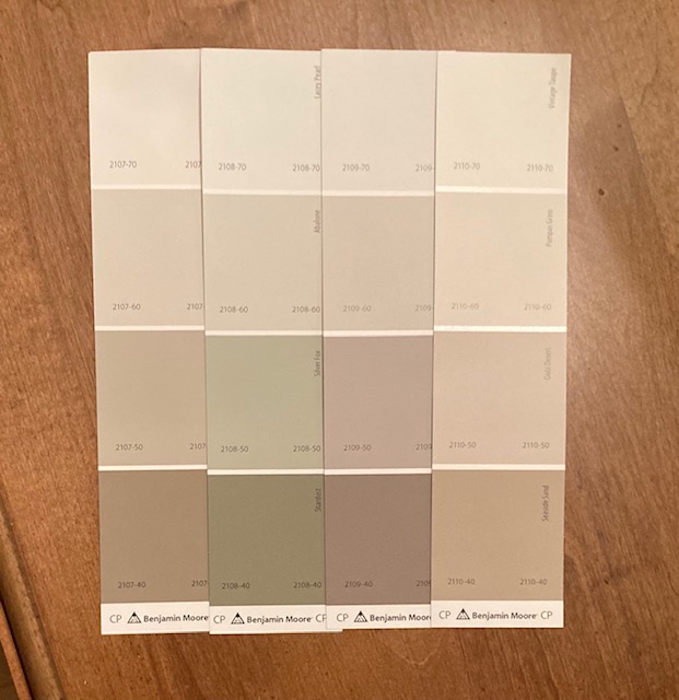 Pieces of paper that show various paint shades.